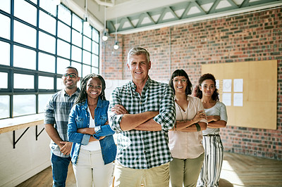 Buy stock photo Shot of a group of creative businesspeople standing together in an office