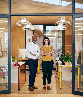 Buy stock photo Portrait of two confident designers standing together in an office