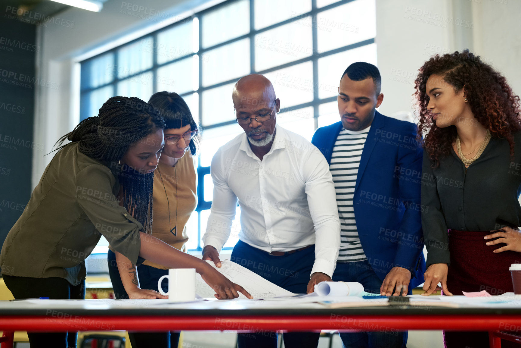 Buy stock photo Shot of a group of creative businesspeople working together on a project
