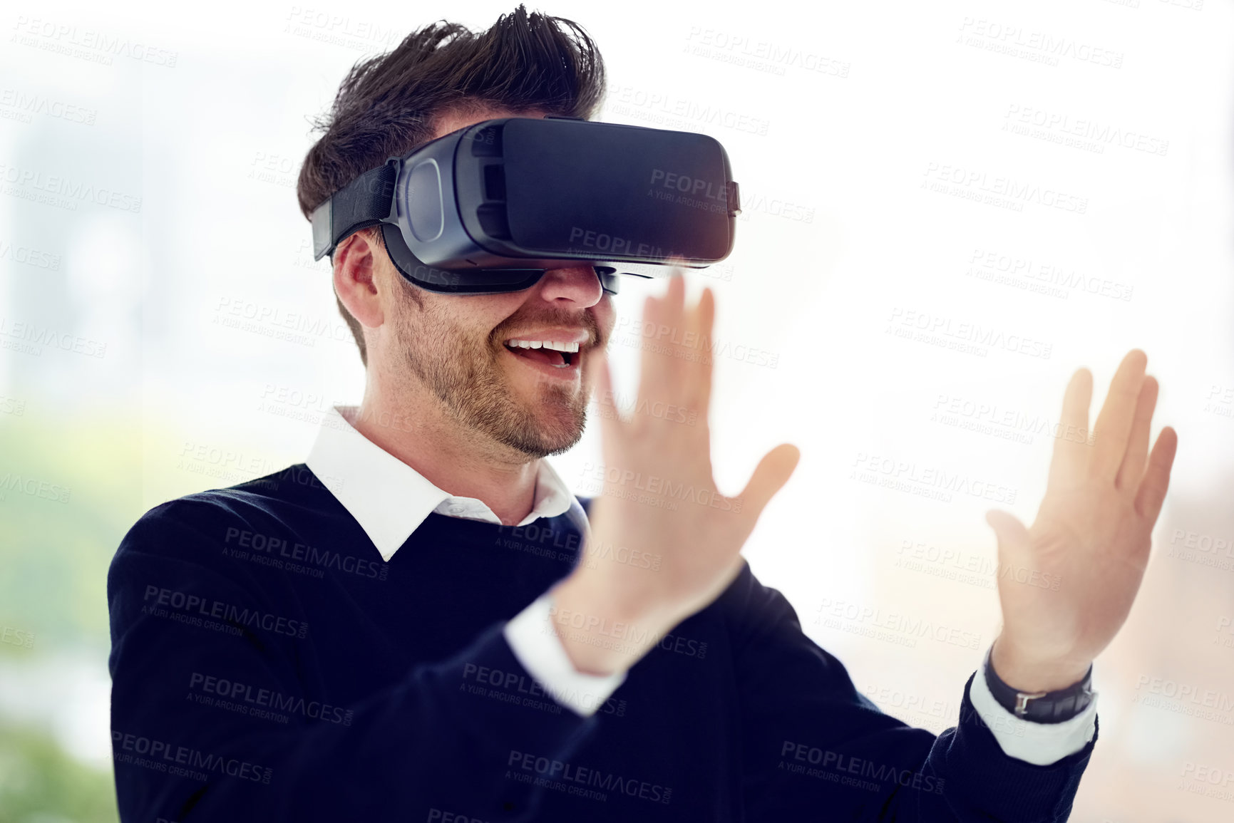 Buy stock photo Shot of a businessman wearing a VR headset in an office