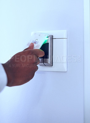 Buy stock photo Unrecognizable shot of a hand using a access card on a scanner to let the person gain access and open a door