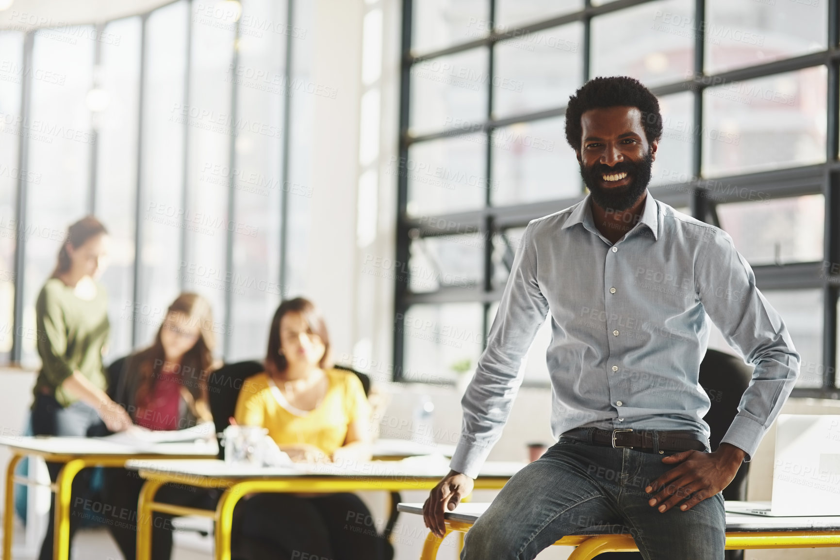 Buy stock photo Portrait of a businessman in an office with his colleagues in the background