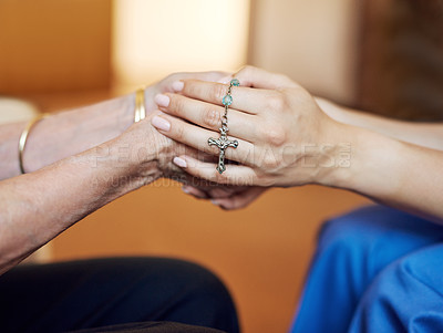Buy stock photo Cropped shot of a senior woman being comforted by her nurse while holding a rosary