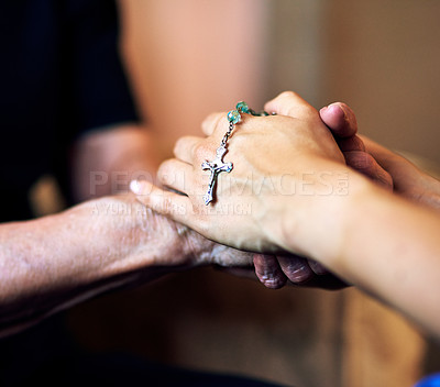 Buy stock photo Cropped shot of a senior woman being comforted by her nurse while holding a rosary