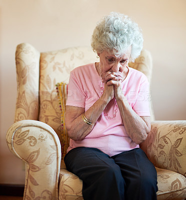 Buy stock photo Cropped shot of a senior woman holding a rosary while praying for a miracle