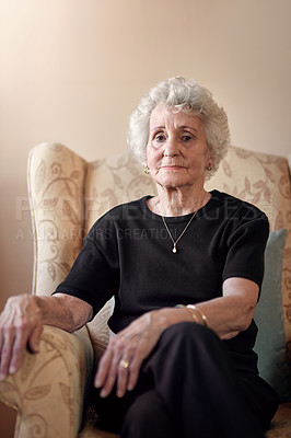 Buy stock photo Portrait of a senior woman sitting on a chair at home