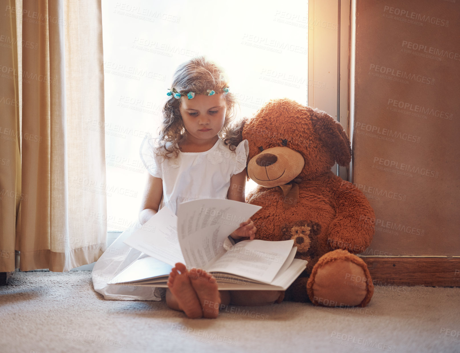 Buy stock photo Girl, child and teddy bear with book for reading with storytelling, fantasy and fairytale on floor in home. Kid, novel and learning in house for language development, education and knowledge with toy