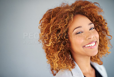 Buy stock photo Studio portrait of a young businesswoman against a gray background