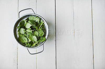 Buy stock photo High angle shot of fresh leaves of spinach on a table