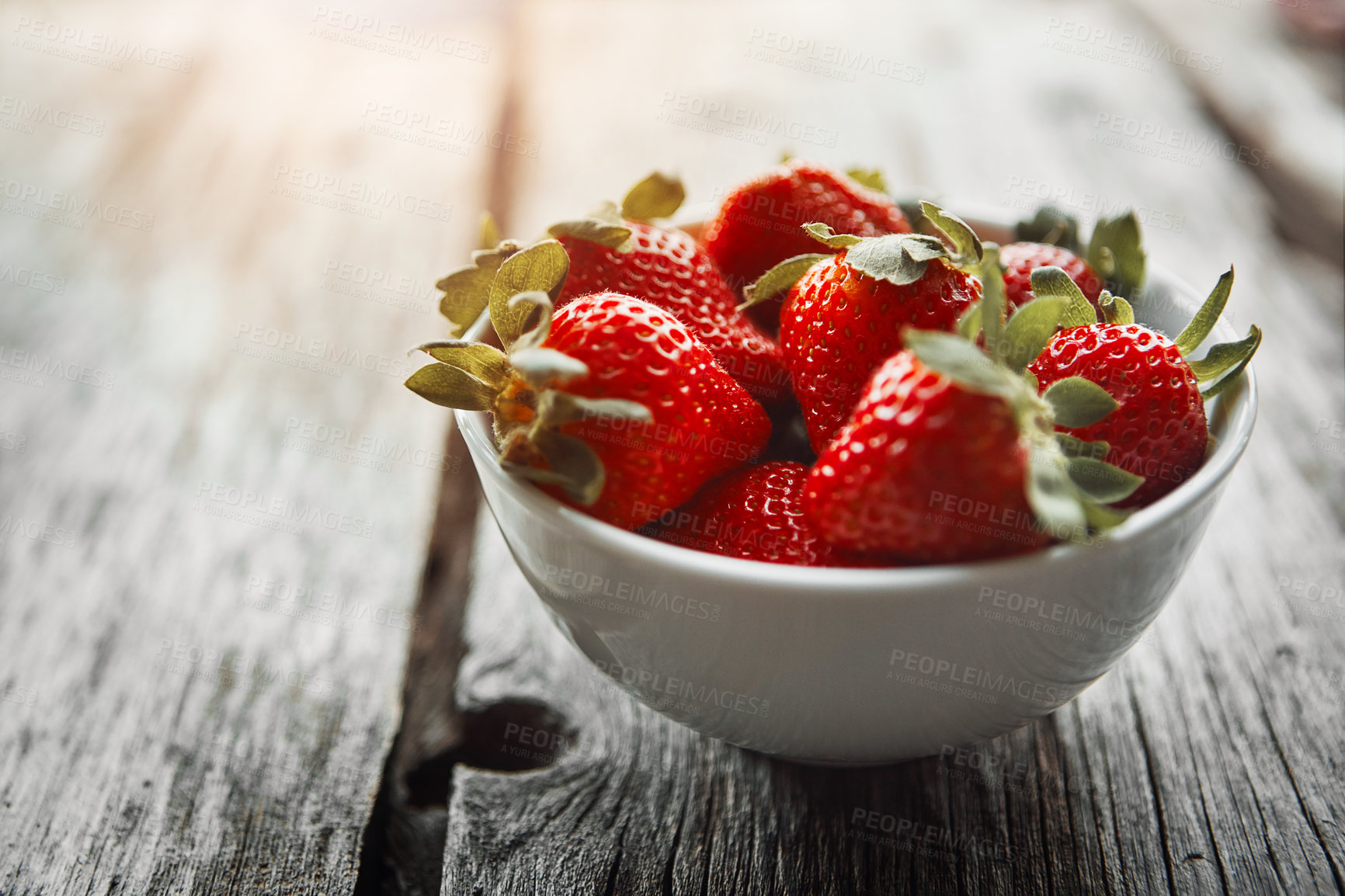 Buy stock photo Strawberry, bowl and table with food and fruit salad for wellness, nutrition and to lose weight. Home, breakfast and sustainable meal or health snack with vitamin A and diet dessert for eating