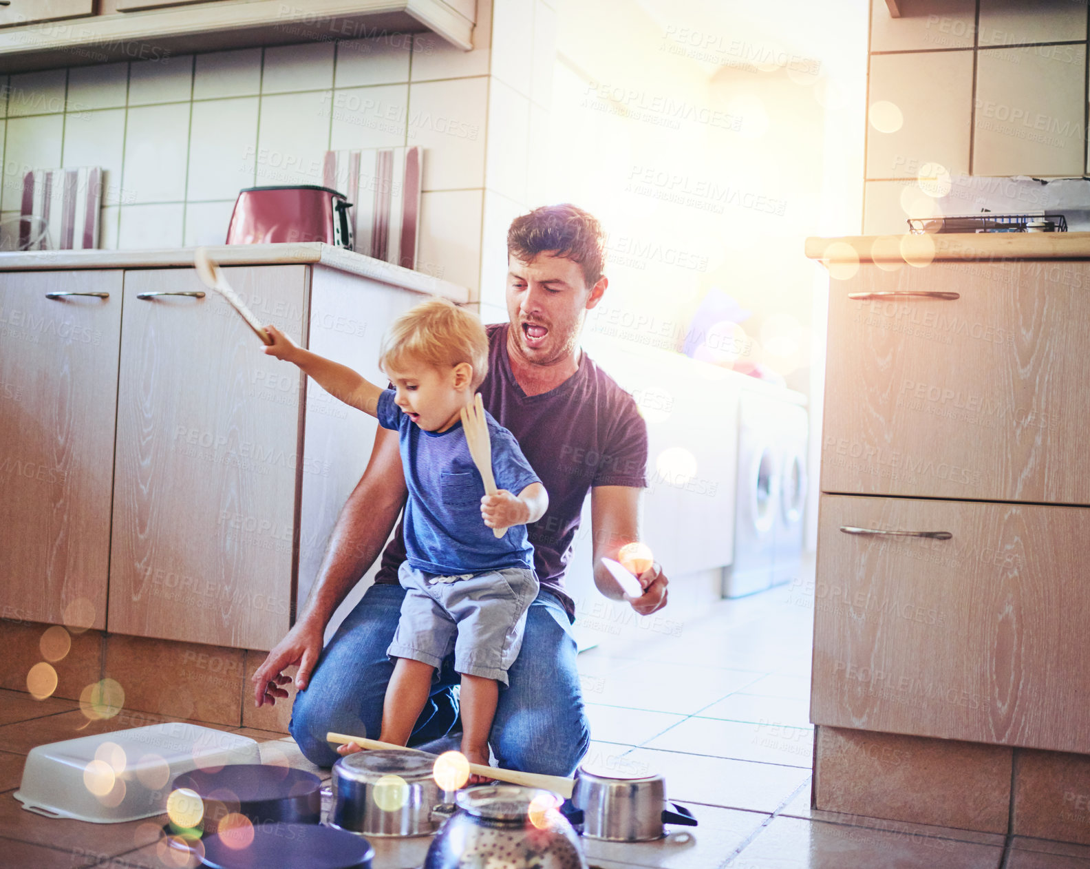 Buy stock photo Father, child and playing drums on pots in home, music games and pretend drummer or performance. Dad, son and kid bokeh in childhood for bonding on weekend, love and together for fun in kitchen