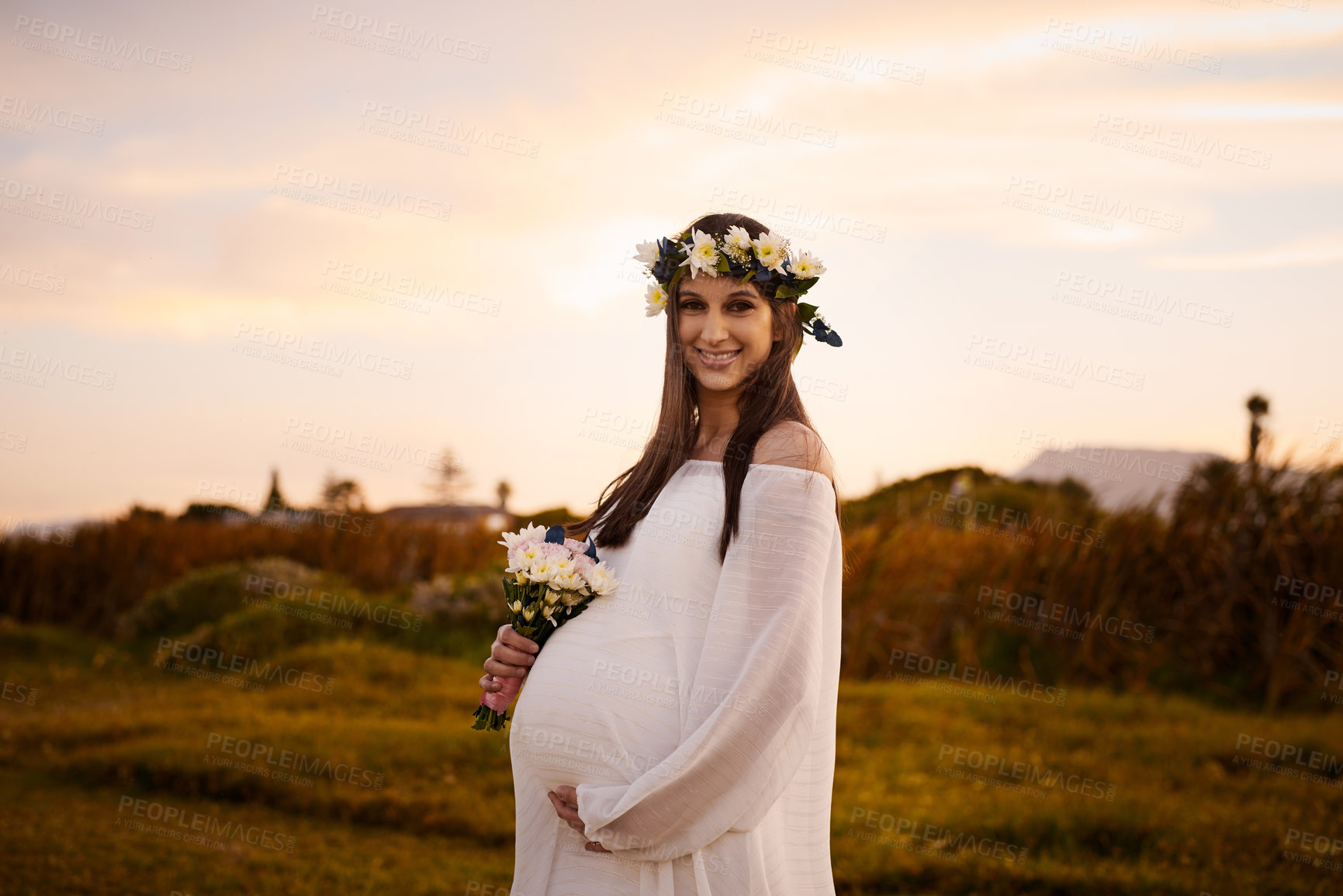 Buy stock photo Pregnant woman, portrait and flowers in outdoor, maternal beauty and countryside for natural growth. Female person, bouquet and park for baby care on holiday, support stomach and vacation for love