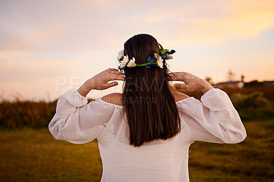 Buy stock photo Rearview shot of a young woman outside