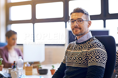 Buy stock photo Cropped portrait of a mature businessman sitting in his office and holding his hands together and looking at the camera