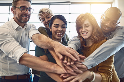 Buy stock photo Hands in a huddle for teamwork, working together and unity between a business team of happy colleagues. A group of motivated and smiling creative designers with a mindset of support and collaboration