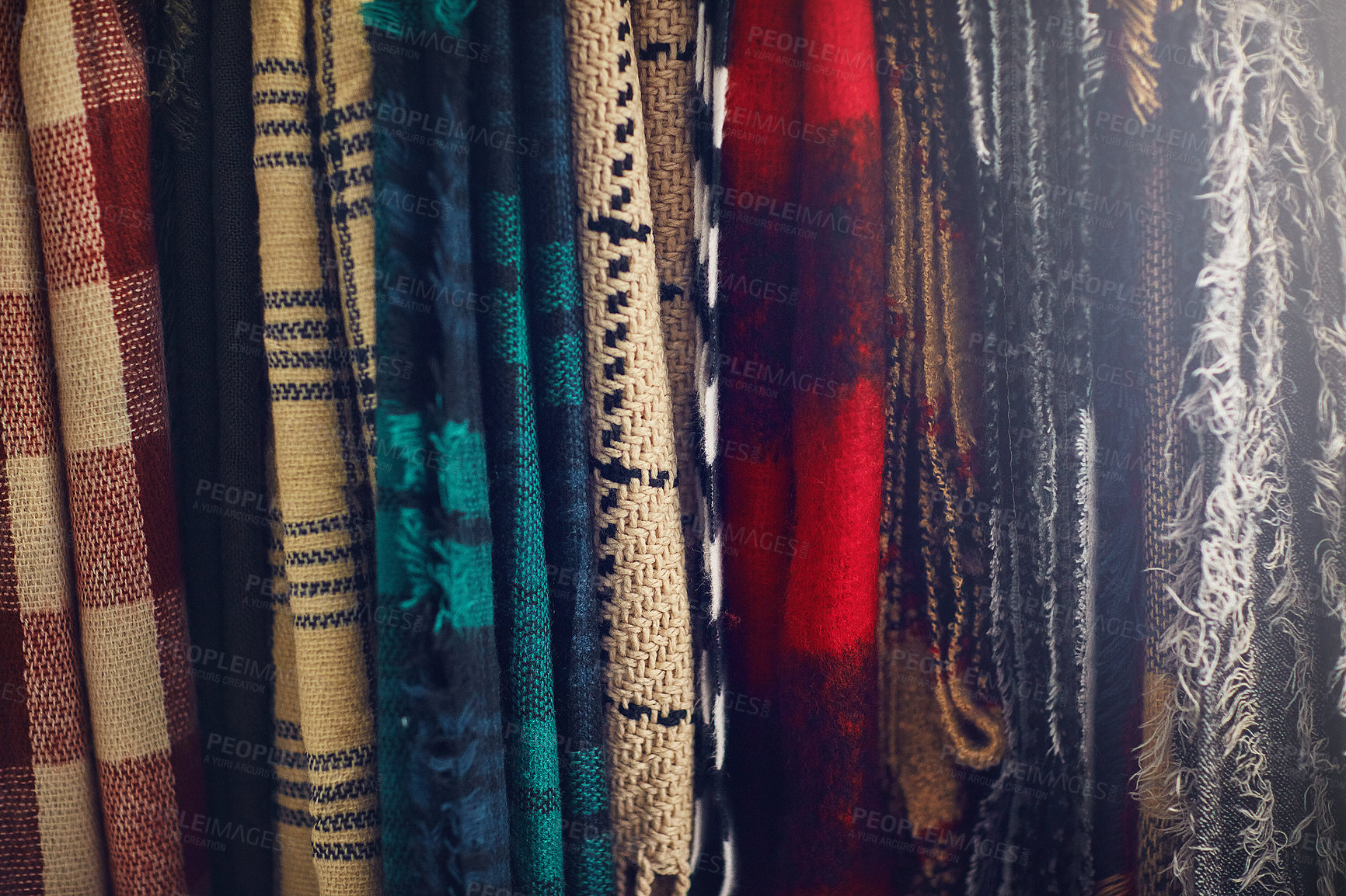 Buy stock photo Closeup shot of scarfs hanging in a store