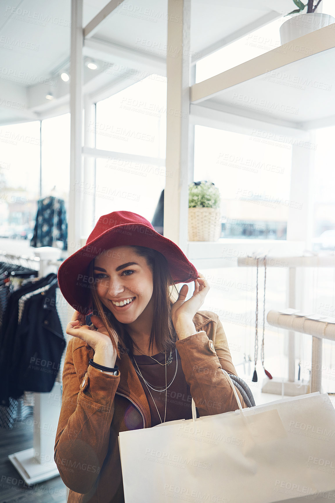 Buy stock photo Cropped portrait of an attractive young woman out on a shopping spree