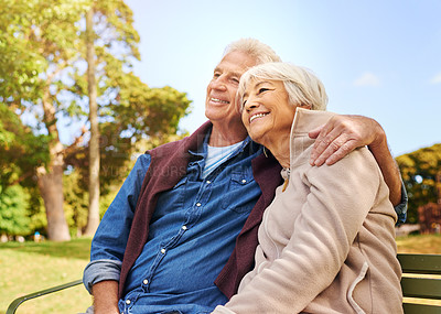Buy stock photo Old couple, hug and relax in the park with smile, happiness together with bonding in nature, love and retirement. Happy, man and woman with travel, relationship with trust in marriage and commitment