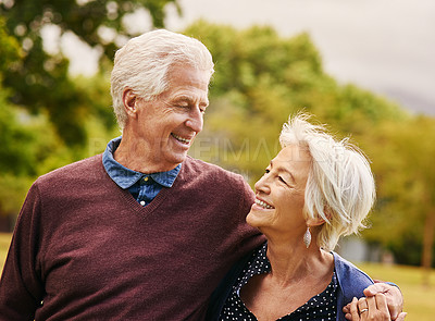 Buy stock photo Shot of a happy senior couple spending time together at the park