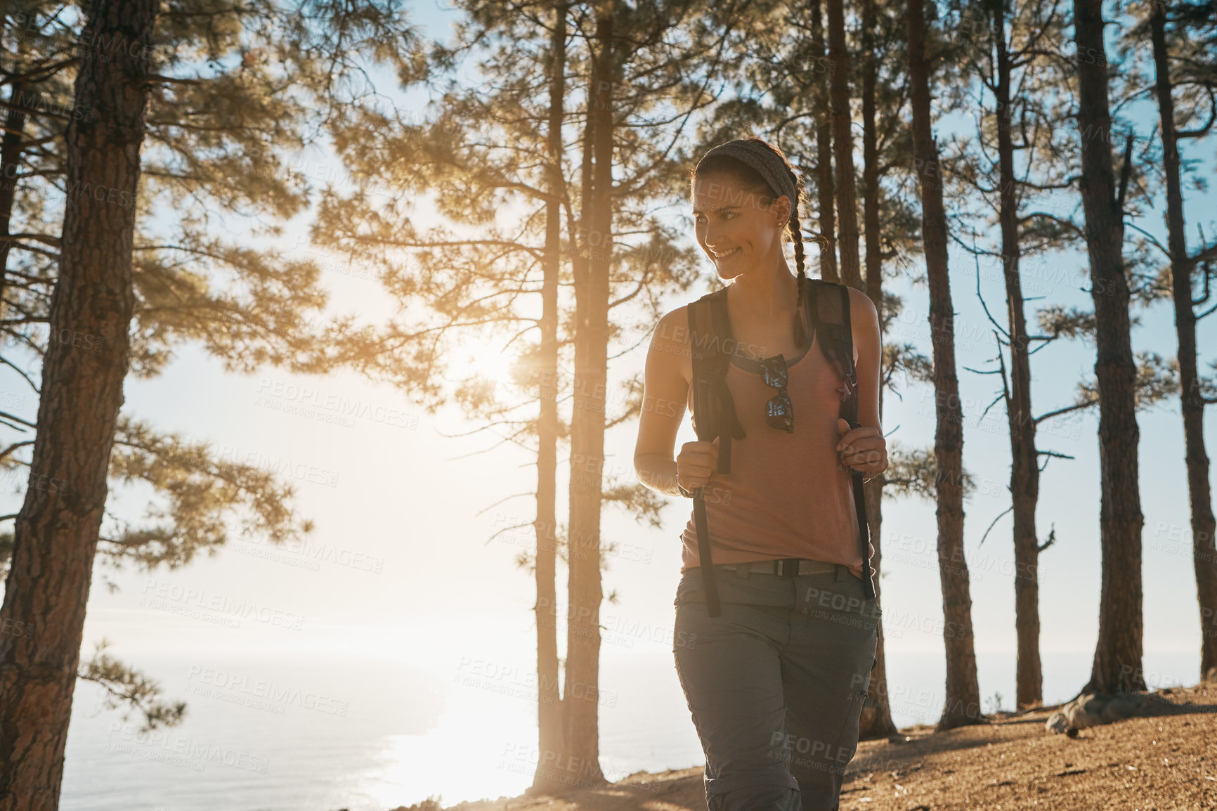 Buy stock photo Shot of a young woman out on a hike in the forest
