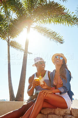 Buy stock photo Cropped shot of an affectionate young couple spending a summer’s day outdoors