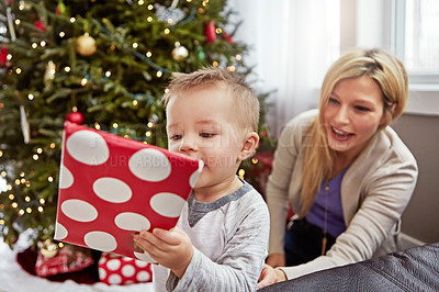 Buy stock photo Shot of a young mother enjoying Christmas with her little boy