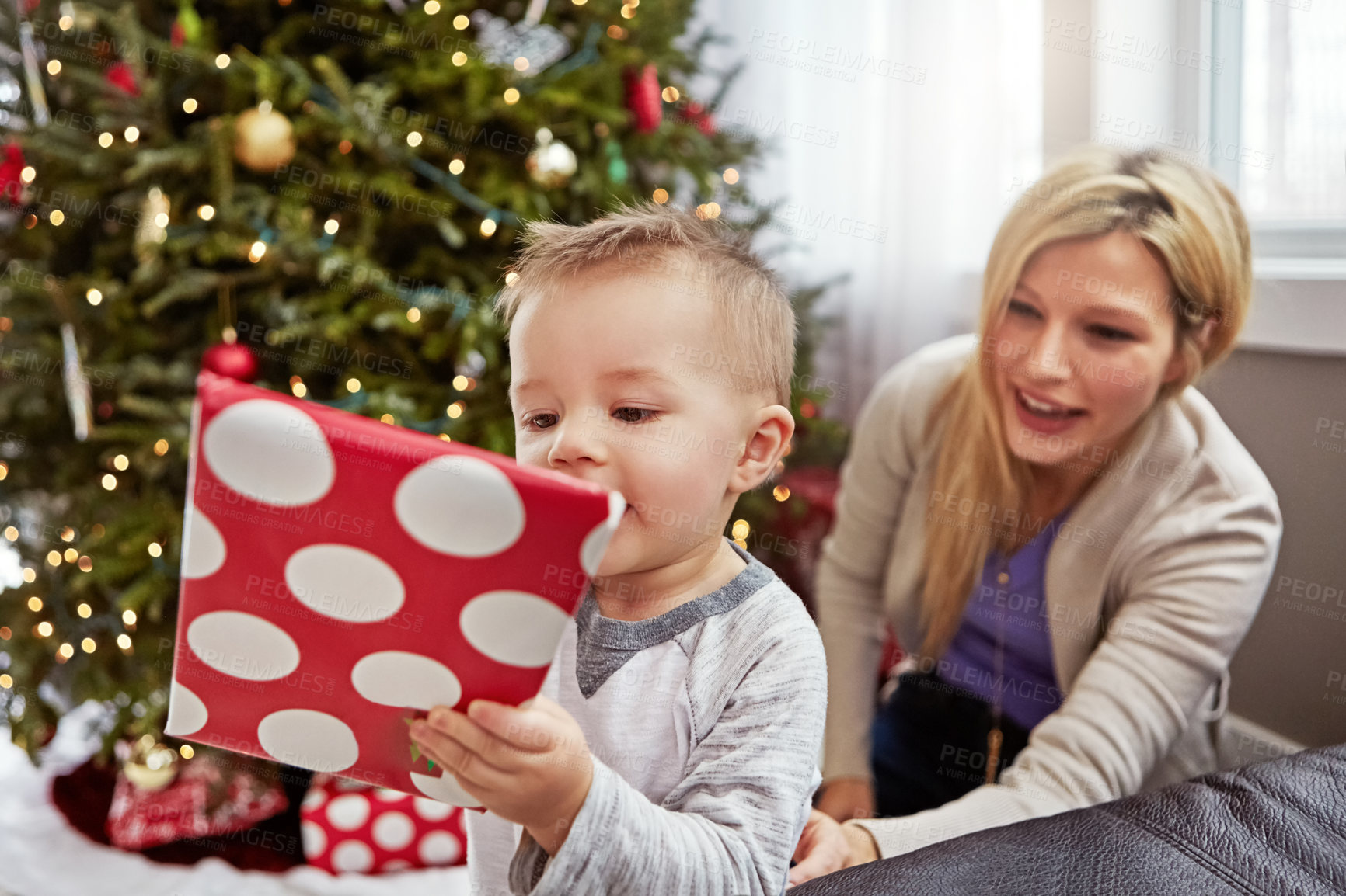 Buy stock photo Shot of a young mother enjoying Christmas with her little boy