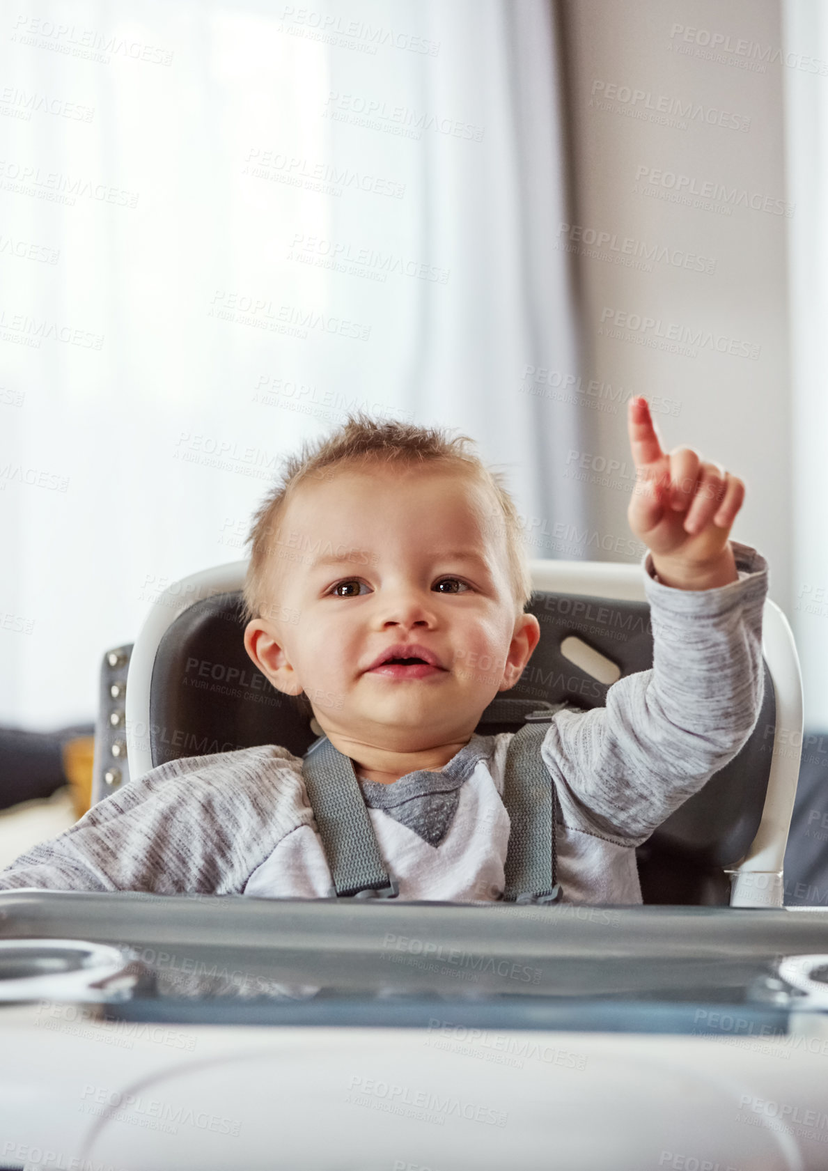 Buy stock photo Baby, high chair and house in portrait for development or wellness, motor skills with finger for growth. Young, boy child and hand in home for healthy learning, waiting for meal time in apartment