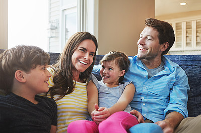 Buy stock photo Shot of a happy family bonding together at home