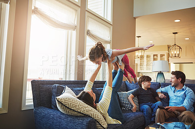 Buy stock photo Shot of a happy family bonding together at home