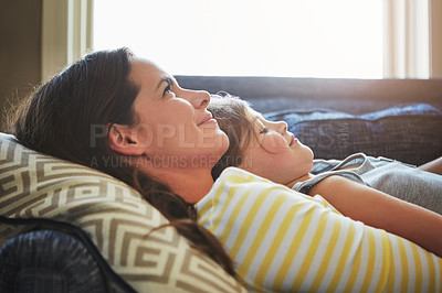 Buy stock photo Love, rest and mother cuddle her child while relaxing on sofa in the living room of their home. Happiness, bonding and young mom embracing and hugging daughter with care in their family house