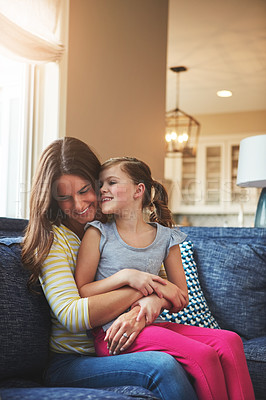 Buy stock photo Happy, woman and child hug with love on sofa for trust, bonding and support of relationship moment. Smile, mother and girl as family for care, security or relax with embrace on couch for childhood