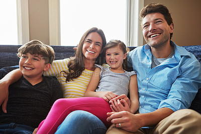 Buy stock photo Shot of a happy family bonding together at home