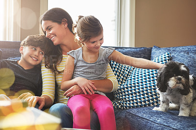 Buy stock photo Shot of a mother bonding with her little son and daughter at home