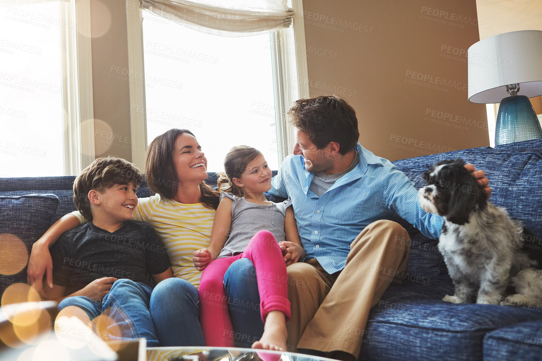 Buy stock photo Shot of a happy family bonding together at home