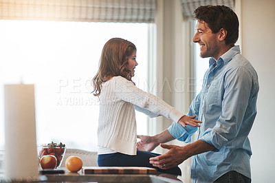 Buy stock photo Father, girl and embrace in kitchen for talking, love and support for relationship in home. Daddy, daughter and together for care or security and smile, speaking and bonding in family house for hug