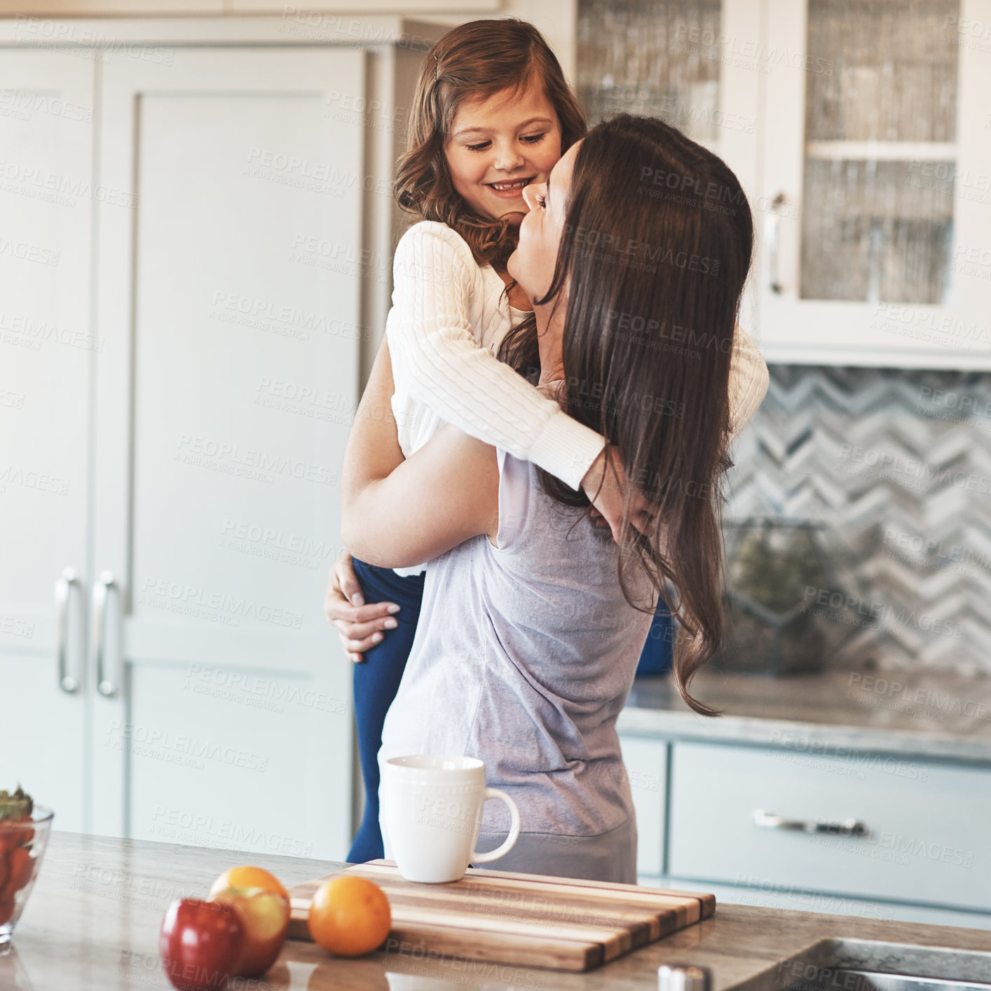 Buy stock photo Smile, mother and hug with girl, kitchen counter or bonding in weekend, house and kid with love. Home, child and mom with daughter, embrace and together in morning, peace or breakfast in apartment