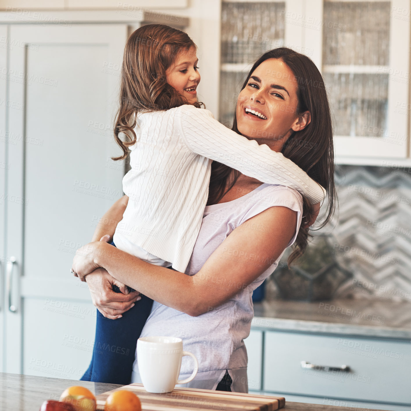 Buy stock photo Portrait, mom and hug with girl, kitchen or smile in weekend, house and kid with love. Bonding, child and mother with daughter, embrace and together in morning, peace or breakfast in apartment