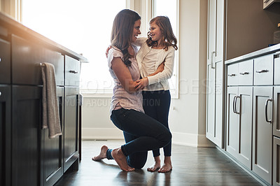 Buy stock photo Together, mom and embrace with girl, kitchen or smile in weekend, house and kid with love. Bonding, child and mother with daughter, hug and care in morning, happy or relax in apartment for peace