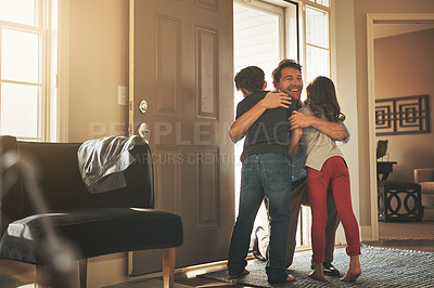 Buy stock photo Home, love and a father hugging his kids after arriving through the front door after work during the day. Greeting, family or children with a man holding his son and daughter in the living room
