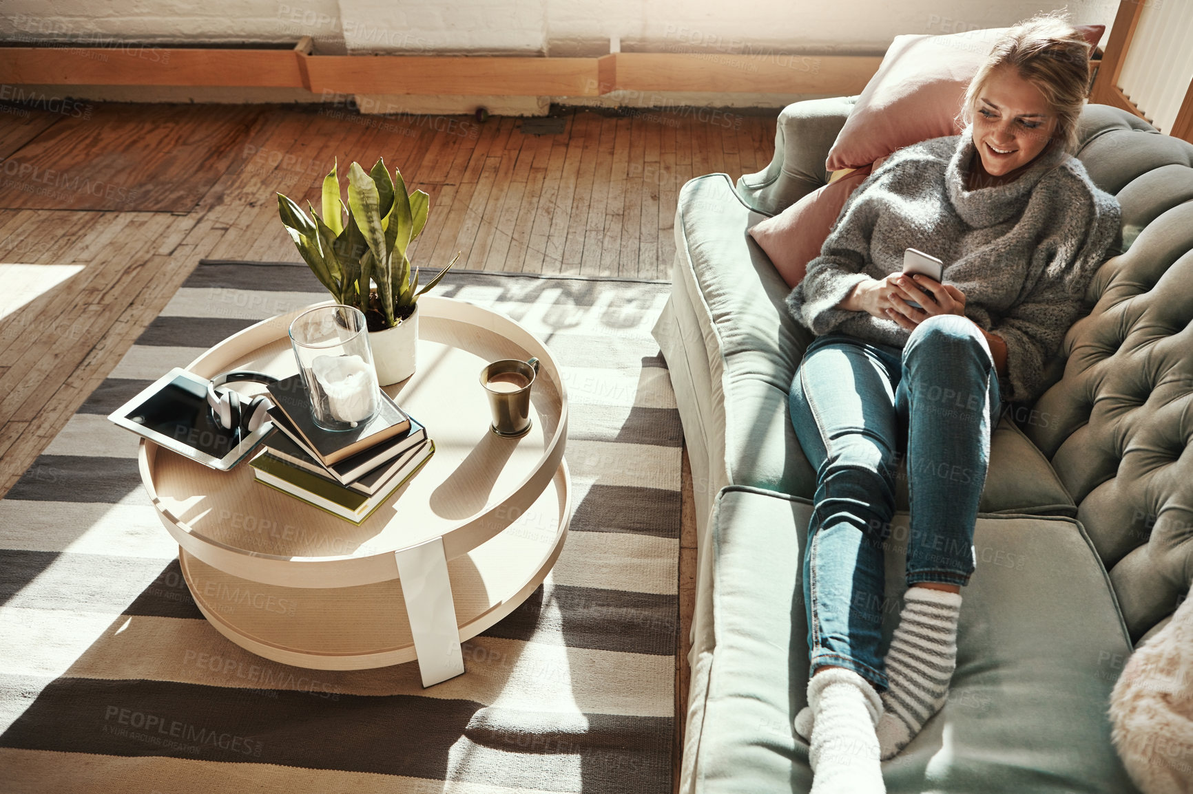 Buy stock photo Relax, home sofa and woman on a phone in a living room calm on a social media scroll. House couch, lounge and person relax on a mobile online on wifi looking happy from streaming web content