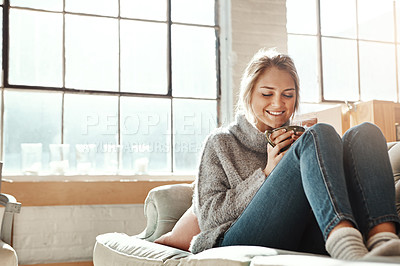 Buy stock photo Woman on sofa, coffee and relax for happiness, break and on weekend for solitude, home and living room. Young female, girl or tea in lounge on couch, comfortable or smile with drink, house and casual