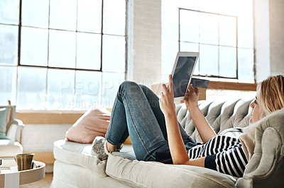 Buy stock photo Woman, tablet and credit card for online shopping on sofa relaxing in the living room for ecommerce at home. Female shopper banking on touchscreen with bank card for purchase, app or sale on couch