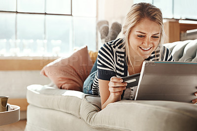 Buy stock photo Tablet, online shopping and girl happy with credit card payment online on living room couch. Relaxed woman checking card details with satisfied smile for ecommerce transaction on home sofa.