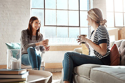 Buy stock photo Woman, friends and smile for coffee, conversation or social catch up relaxing together on living room sofa at home. Happy women enjoying tea time, chatting or gossip with drink in apartment on couch