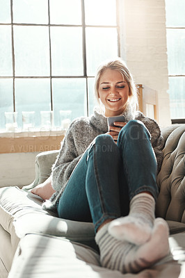 Buy stock photo Phone, smile and woman in home on social media, news and reading email in living room. Smartphone, relax and happy girl on sofa to scroll on app, blog and chat on mobile website on internet in house