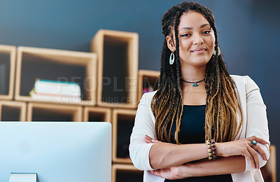 Buy stock photo Cropped portrait of an attractive young woman standing with her arms crossed in her home office