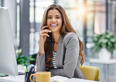 Buy stock photo Cropped portrait of an attractive young businesswoman sitting at her desk in the office