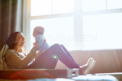 Buy stock photo Happy, mother and baby on sofa relax on weekend for love, bonding and relationship development in home. Care, woman and child together on couch in summer for safety, support or playing in living room