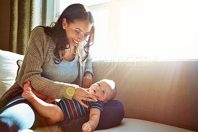 Buy stock photo Happy, mother and baby on sofa playing on weekend for love, bonding and relationship development in home. Care, woman and child together on couch in summer for safety, support or rest in living room